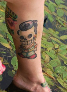 A tattoo of a skeleton that looks like Elvis