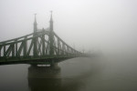 An unremarkable bridge in a remarkable fog.